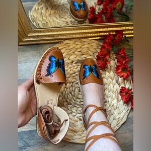 Brown Flats with Blue Butterfly Design